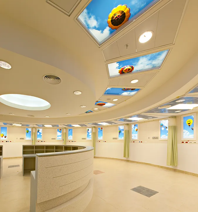 Fanciful balloon-filled SkyCeilings and Luminous Virtual Windows are installed in the pediatrics treatment area.